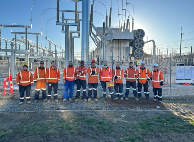 Crew in front of interconnecting transformer at Redclyffe substation