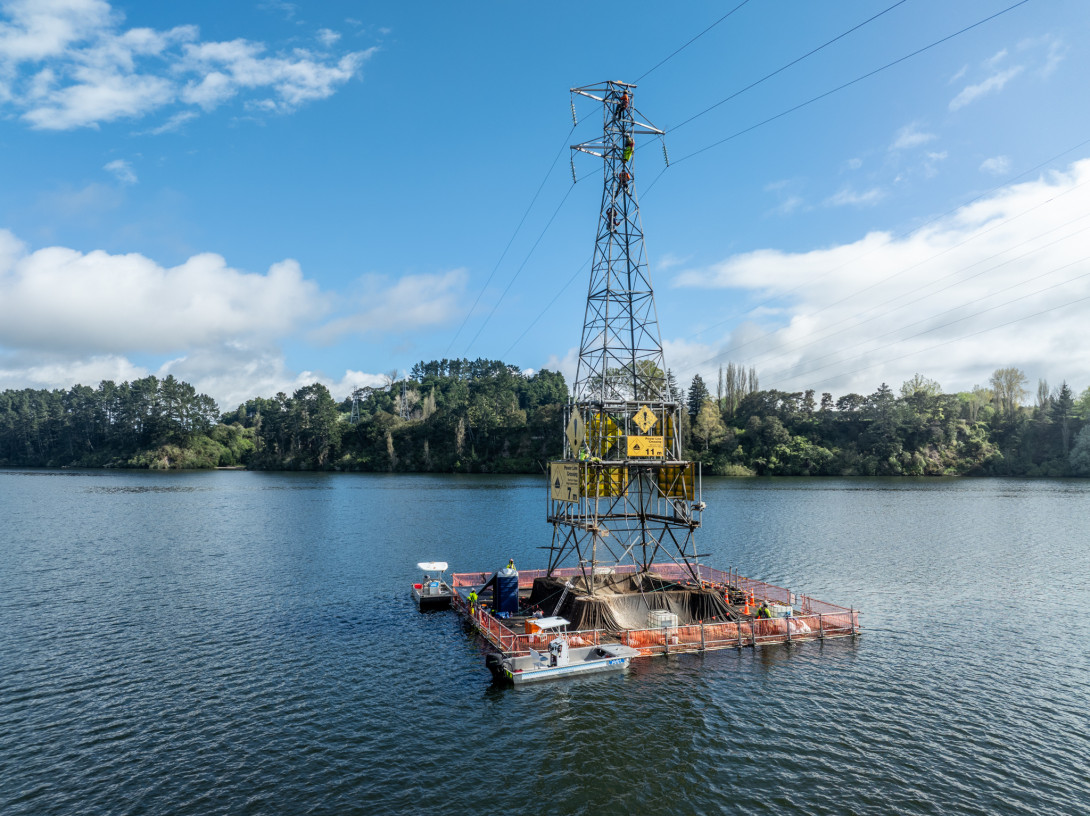 Image of a transmission tower on a lake